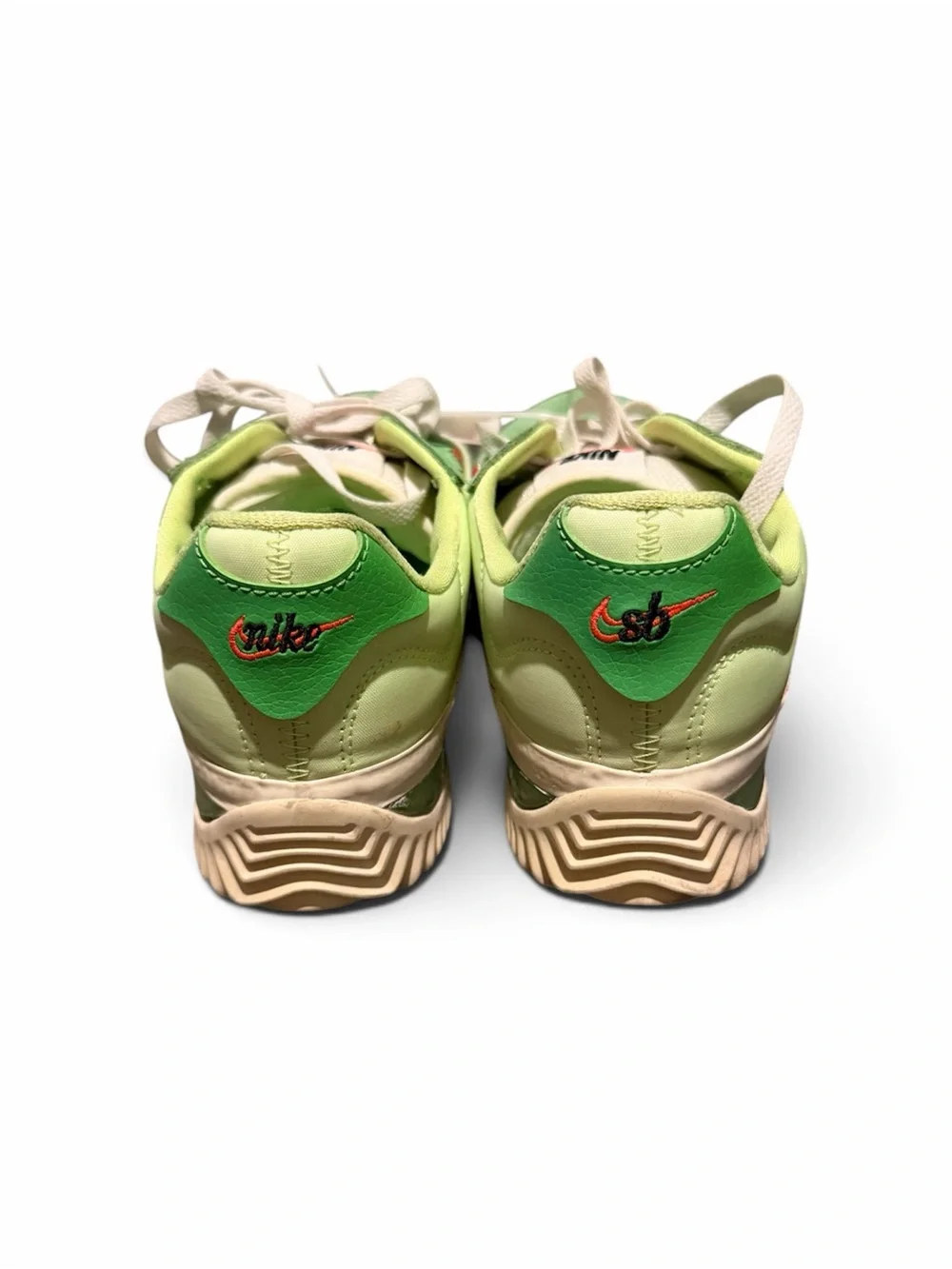 Nike Green Low-Top Athletic Shoes with Red Swoosh